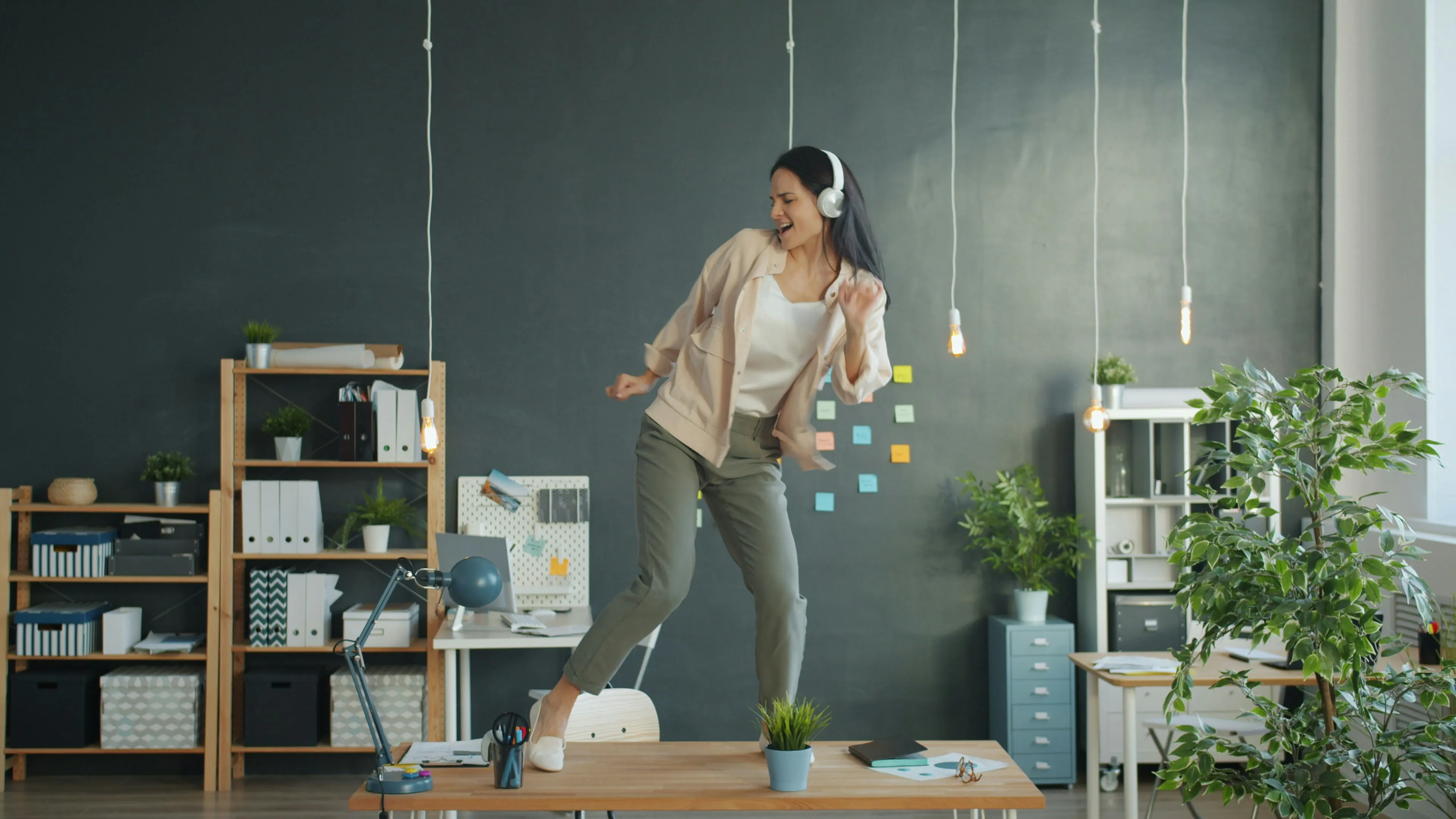 Predikt AI: Employee dancing on desk